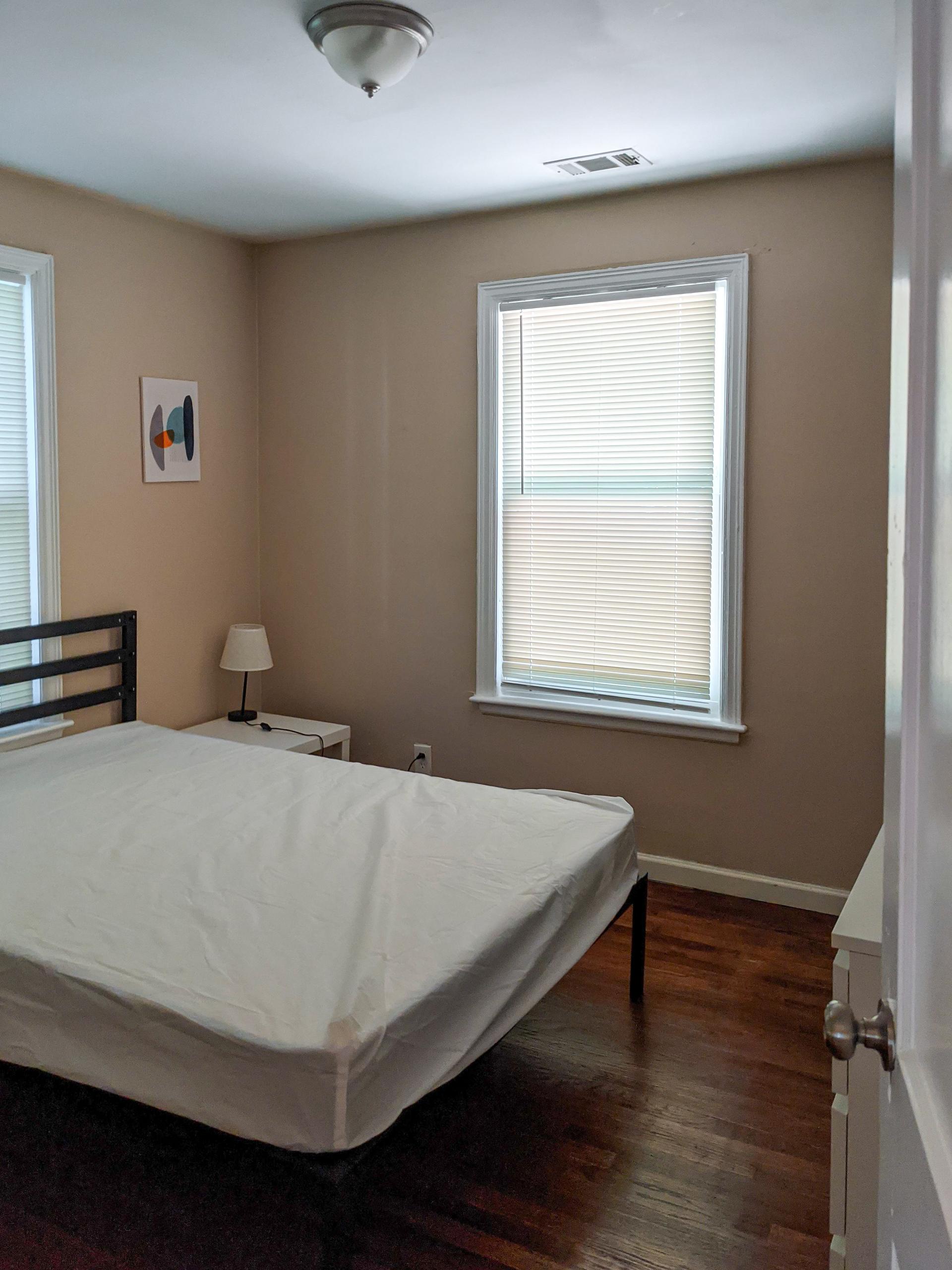 Room #5 - Bed, nightstand, lamp, window
