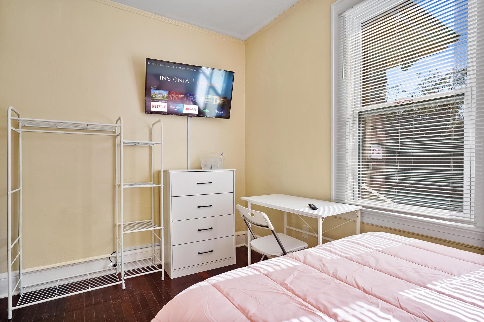 Room 5 comes with a walk in closet, TV, mini fridge, desk, chair, dresser, cubbies, and bed with linens included
