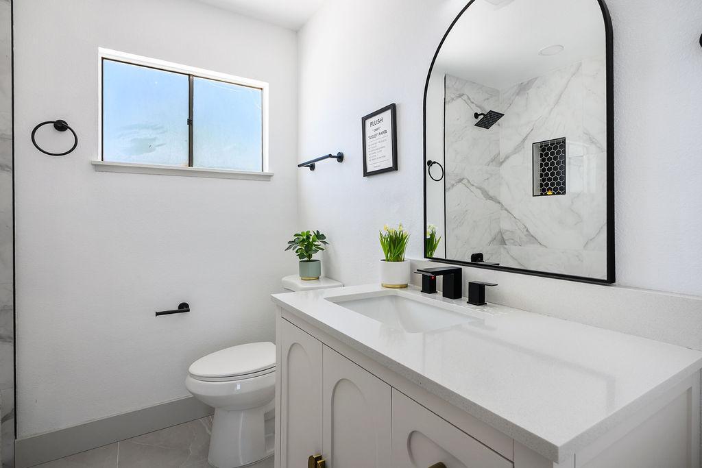 Quartz countertop, elongated toilet