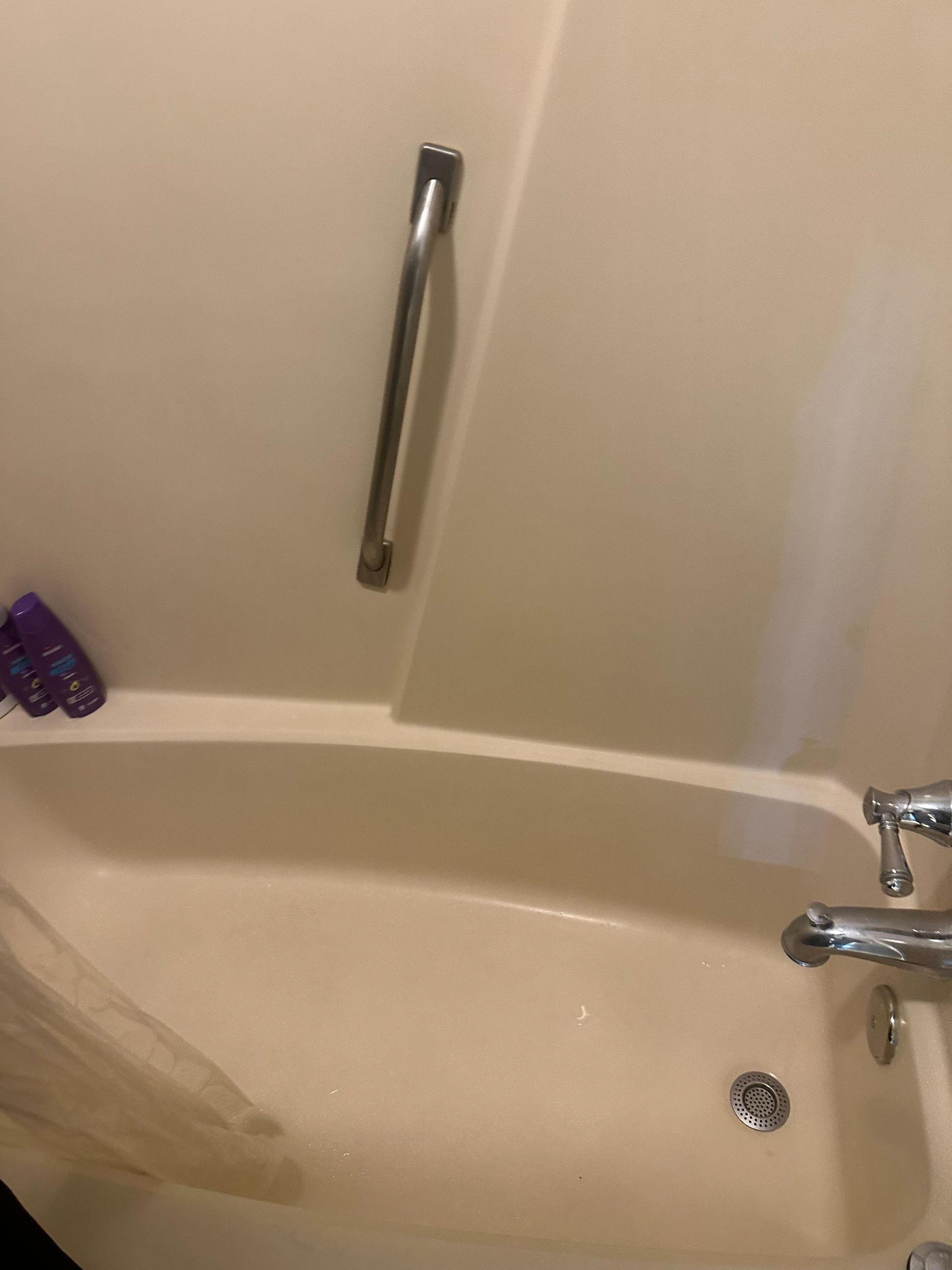 Tub shower combo with hand held shower head.