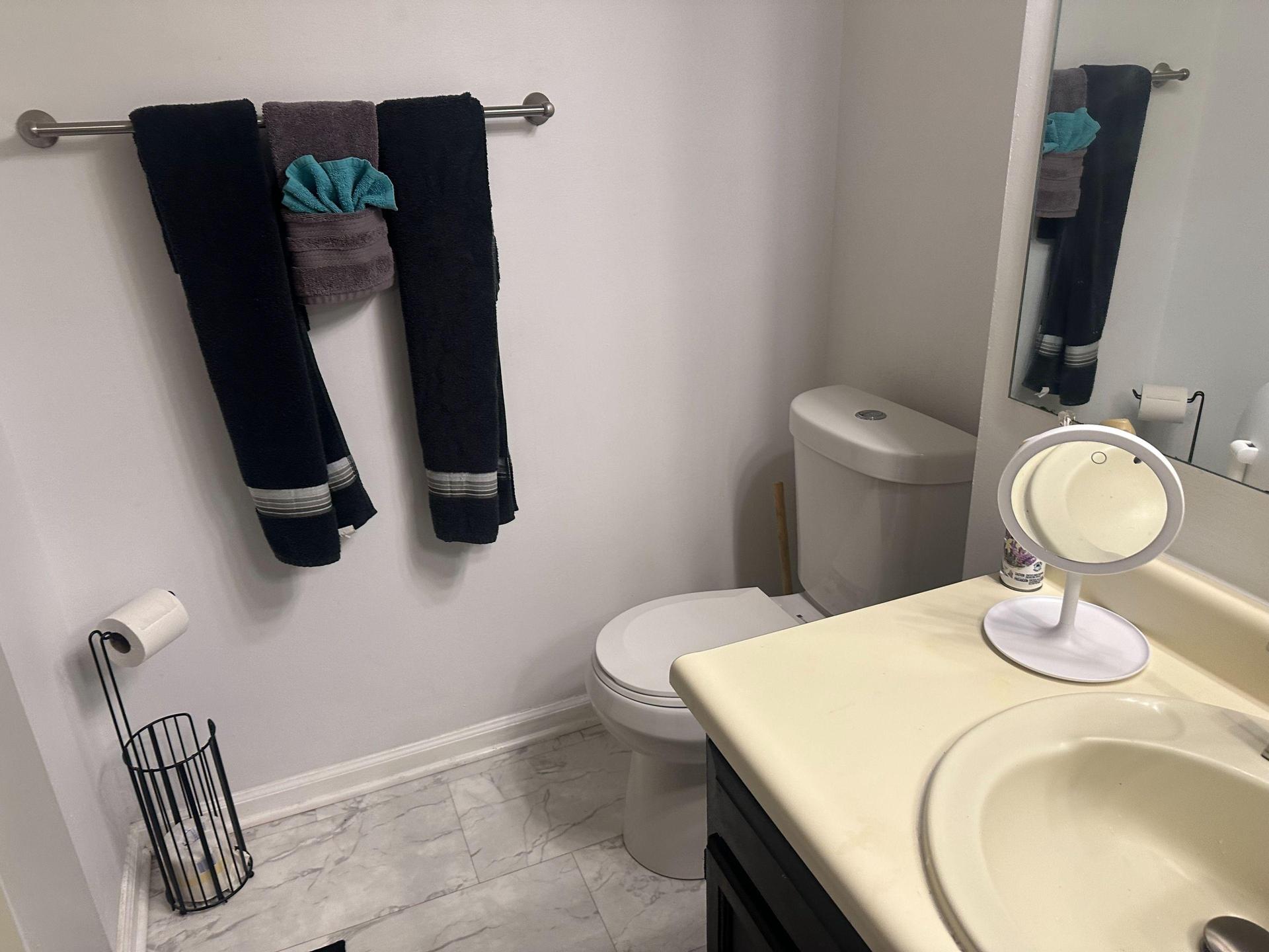 Your private sink has a cabinet for storage and