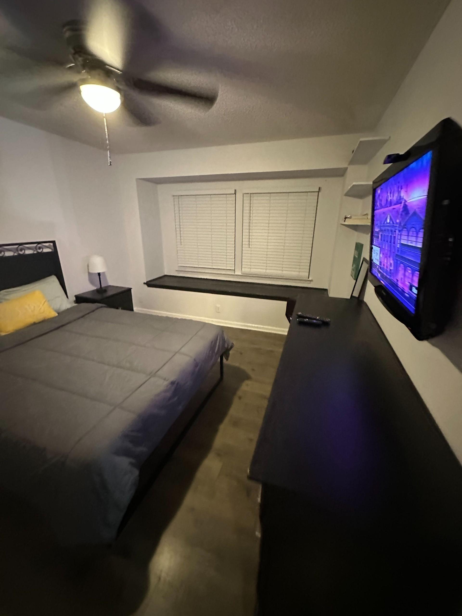 This room features a queen size bed, window seat, ceiling fan, large mounted over the dresser Smart TV with 2 remotes.