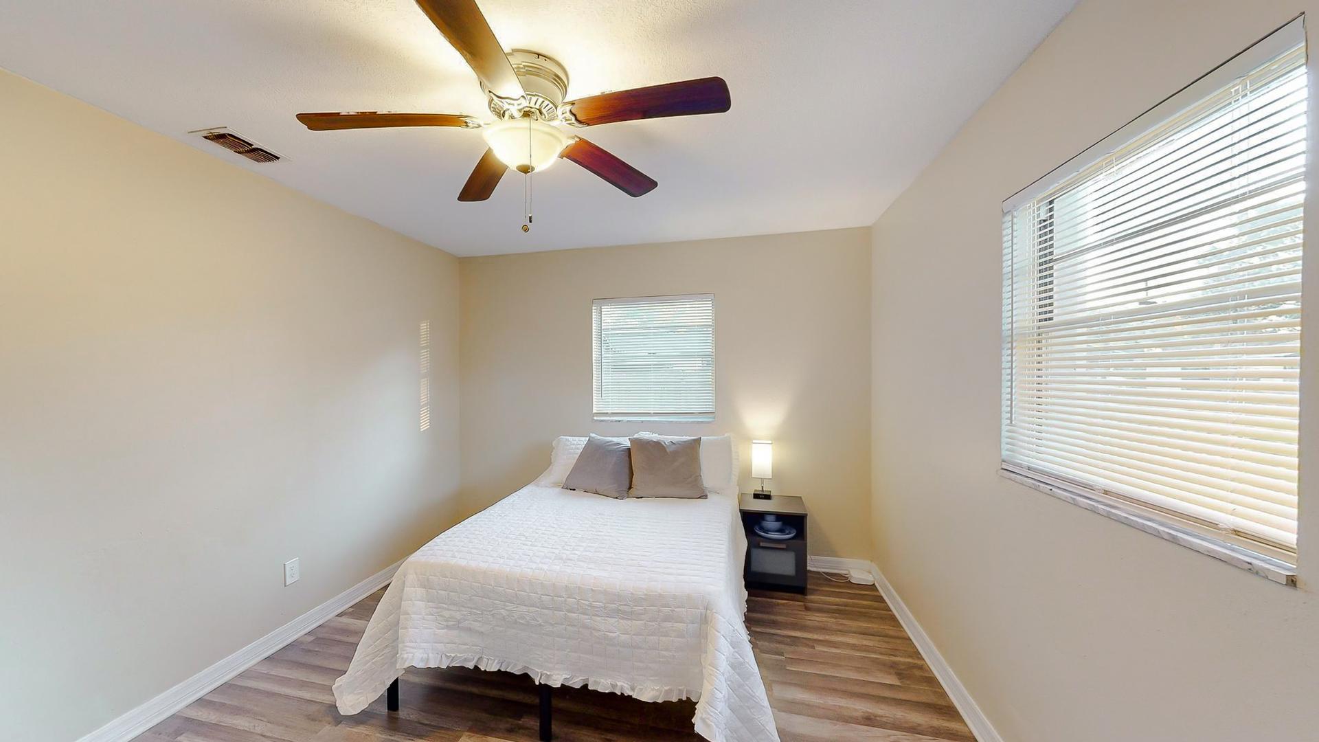 bedroom, detected: window blind, ceiling fan, bed