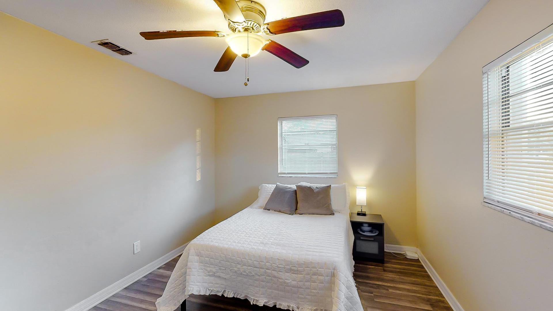 bedroom, detected: window blind, ceiling fan, bed