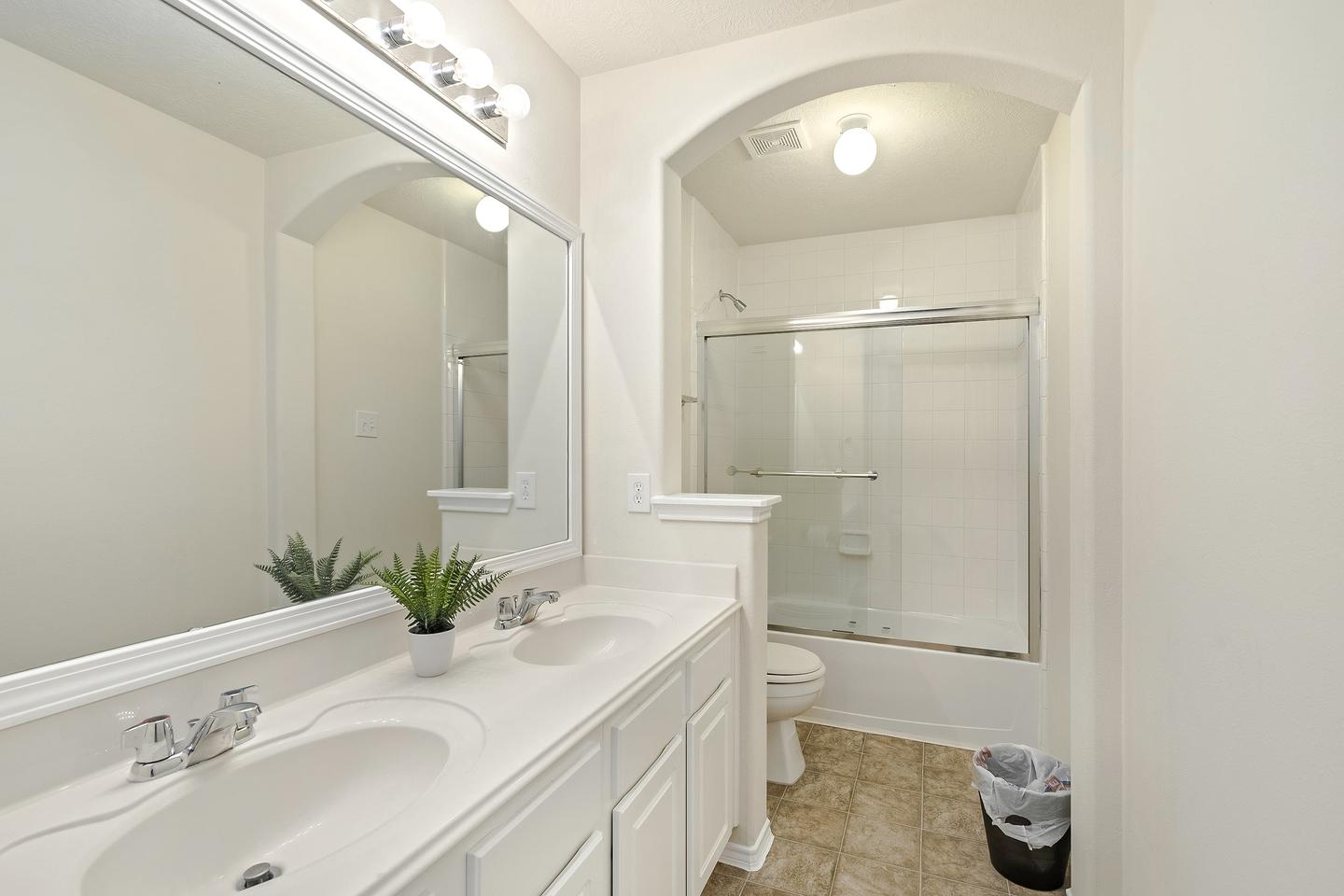 Double vanity is the standard for our royal tenants. This second bathroom has standup shower with tub