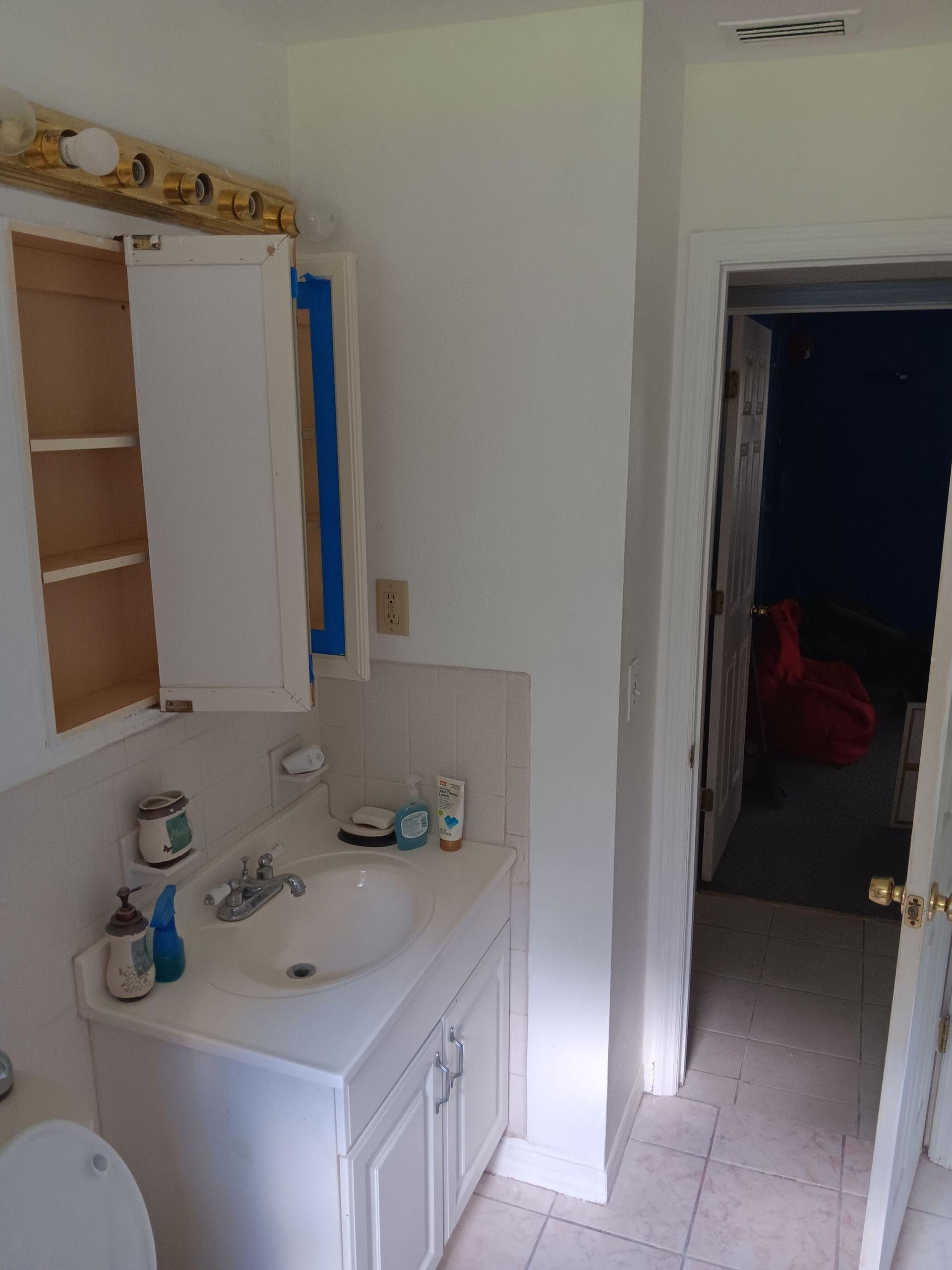 Believe, Praise, Serve, Trust bathroom with bathtub, shower plus attachments.