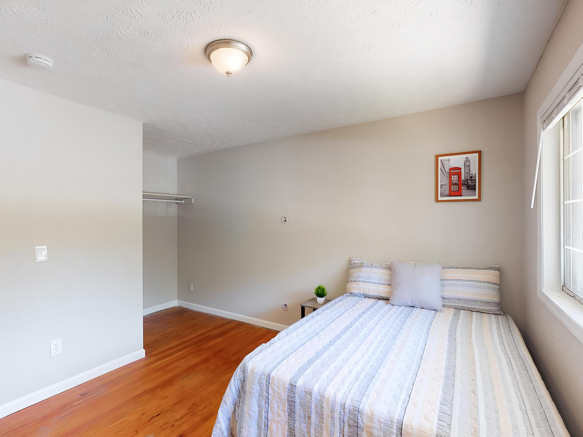 on the top floor, full-bed, with wide street view window. Across from the kitchen. Room size of 11'6"x10'5"