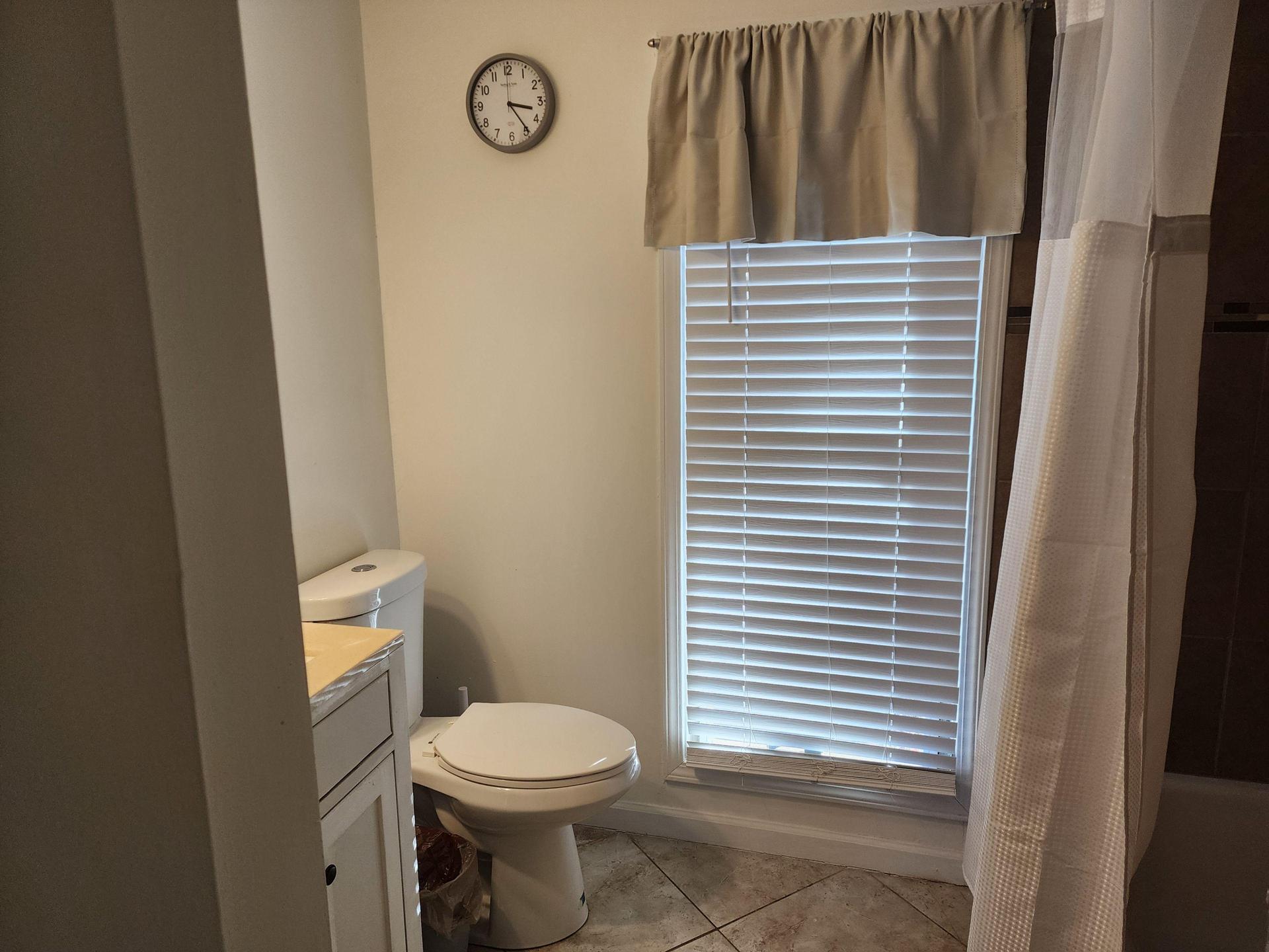 Shared Full Bathroom w/ personal shelves for members