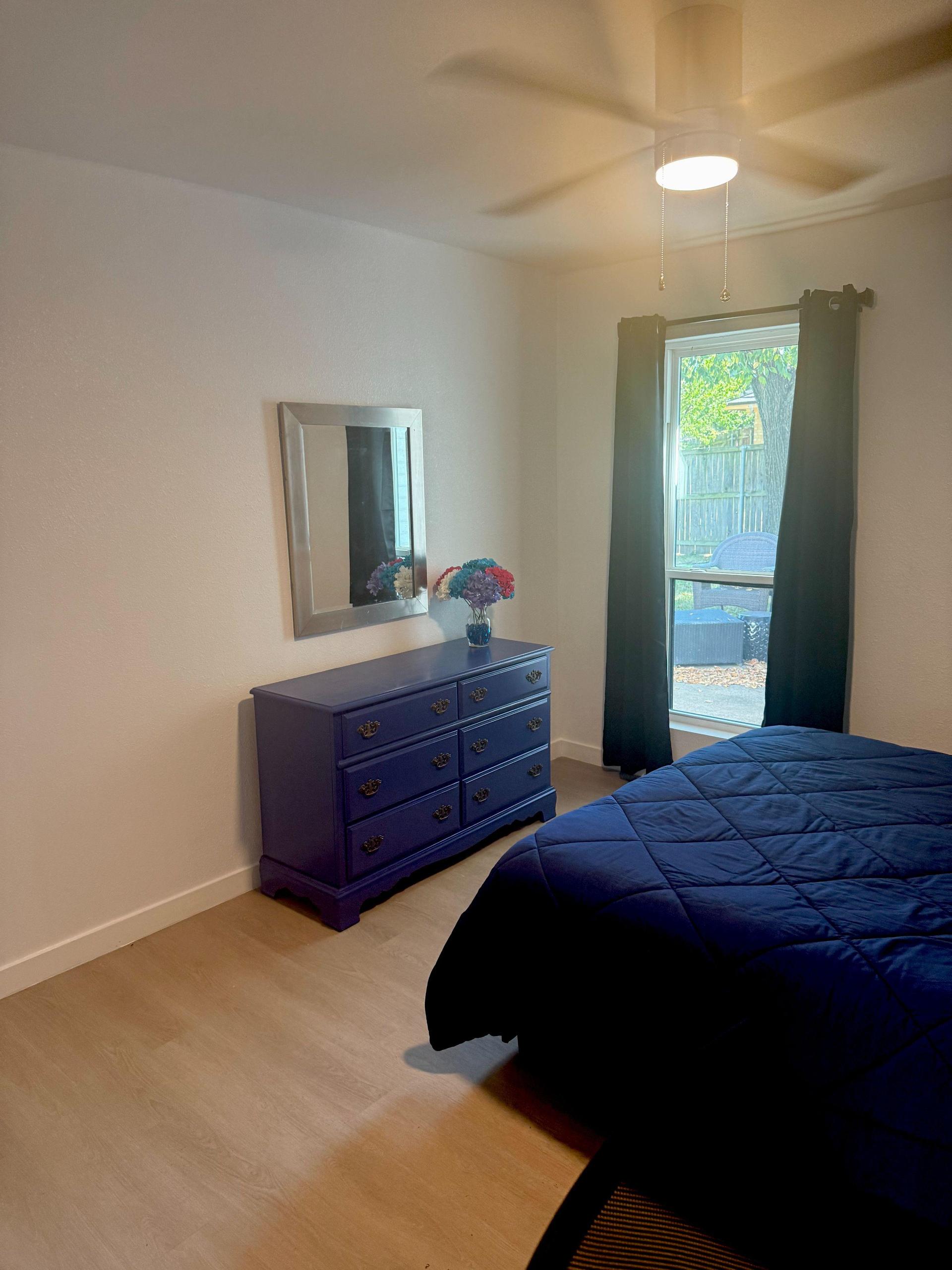 Dresser and window looking out at patio