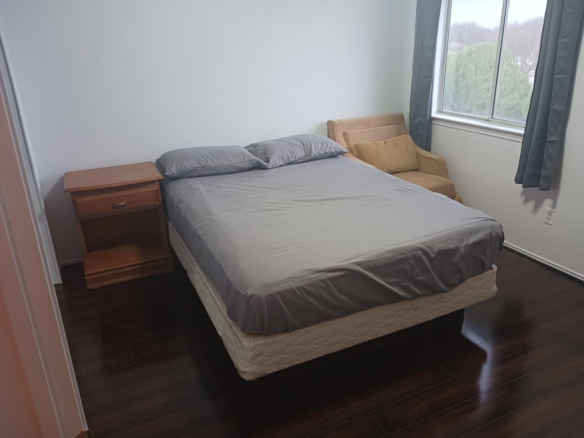 East-facing queen bedroom, lounge chair, mini-fridge, ceiling fan, full dresser and 6'8" wide closet.