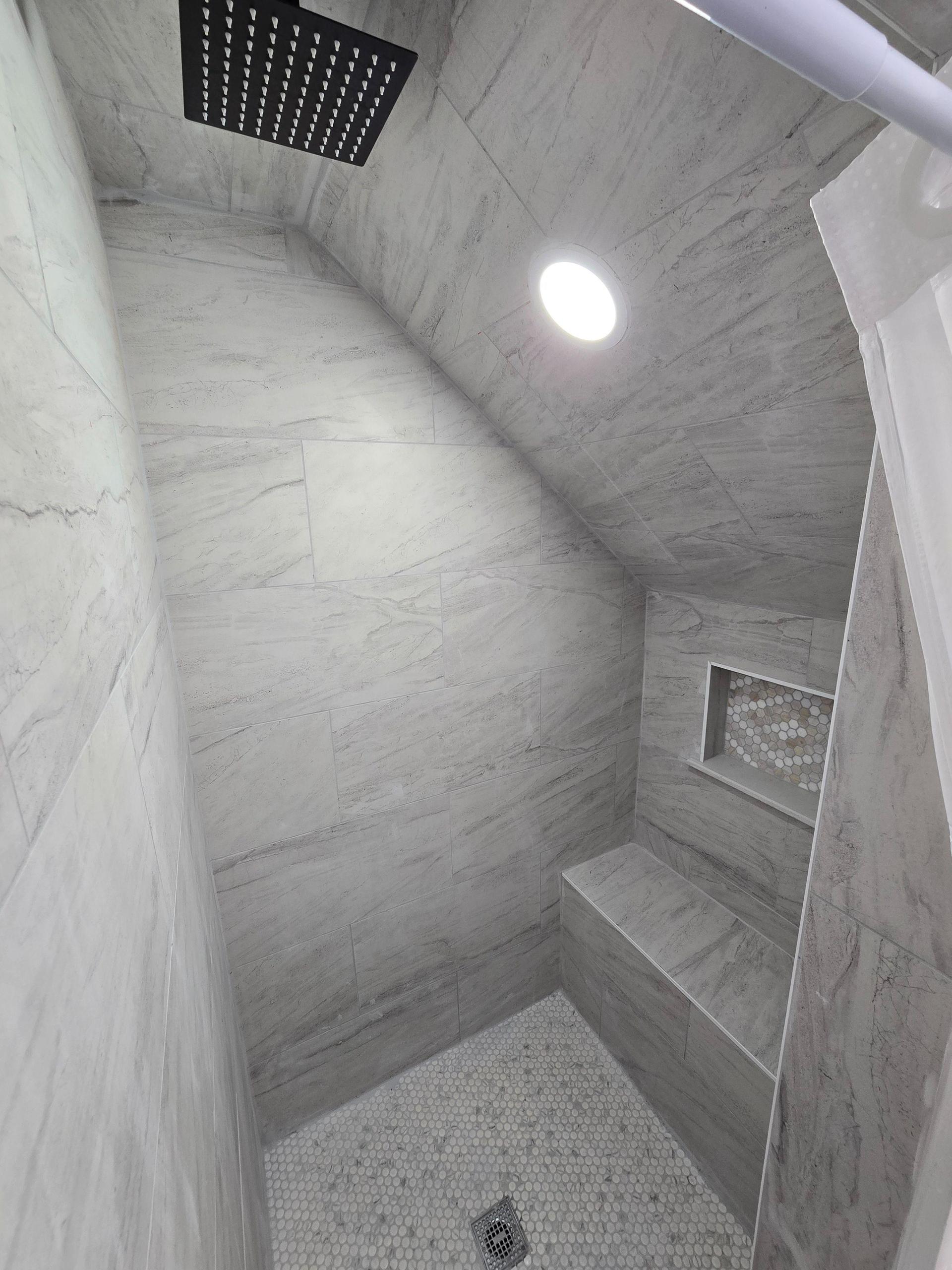 New shower with rain shower head and bench