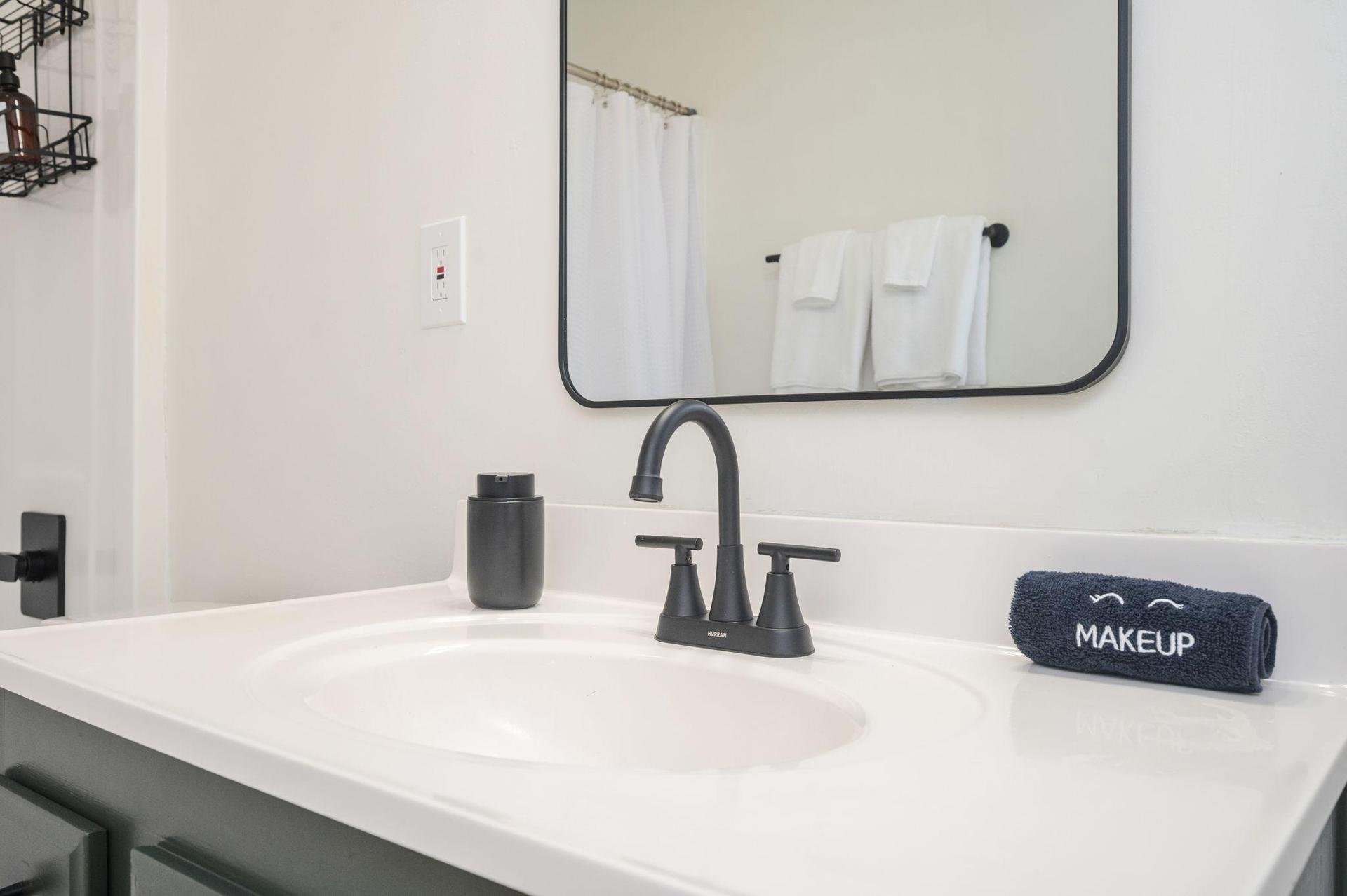 Main floor bathroom with bathtub and shower