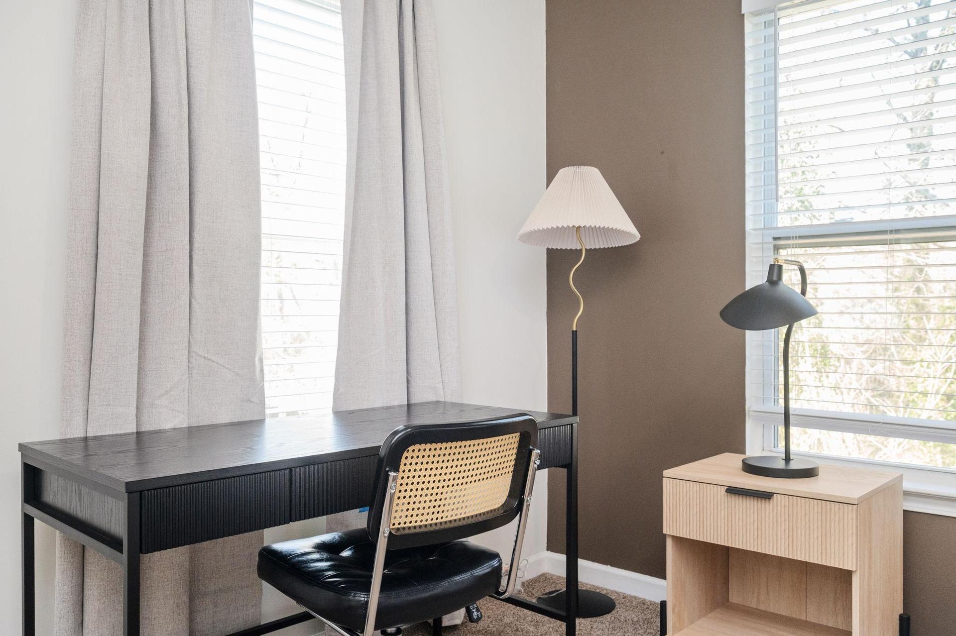 Full-sized desk, lamp, and bedside nightstands