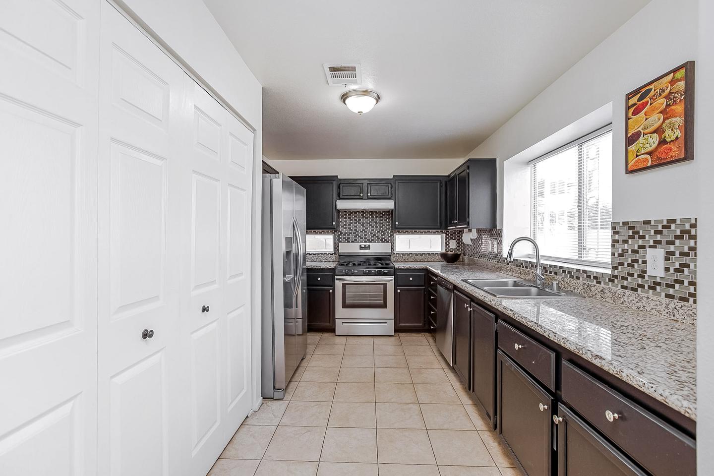 Remodeled Kitchen with Granite Countertops, Tile Backsplash and brand new appliances and a HUGE pantry