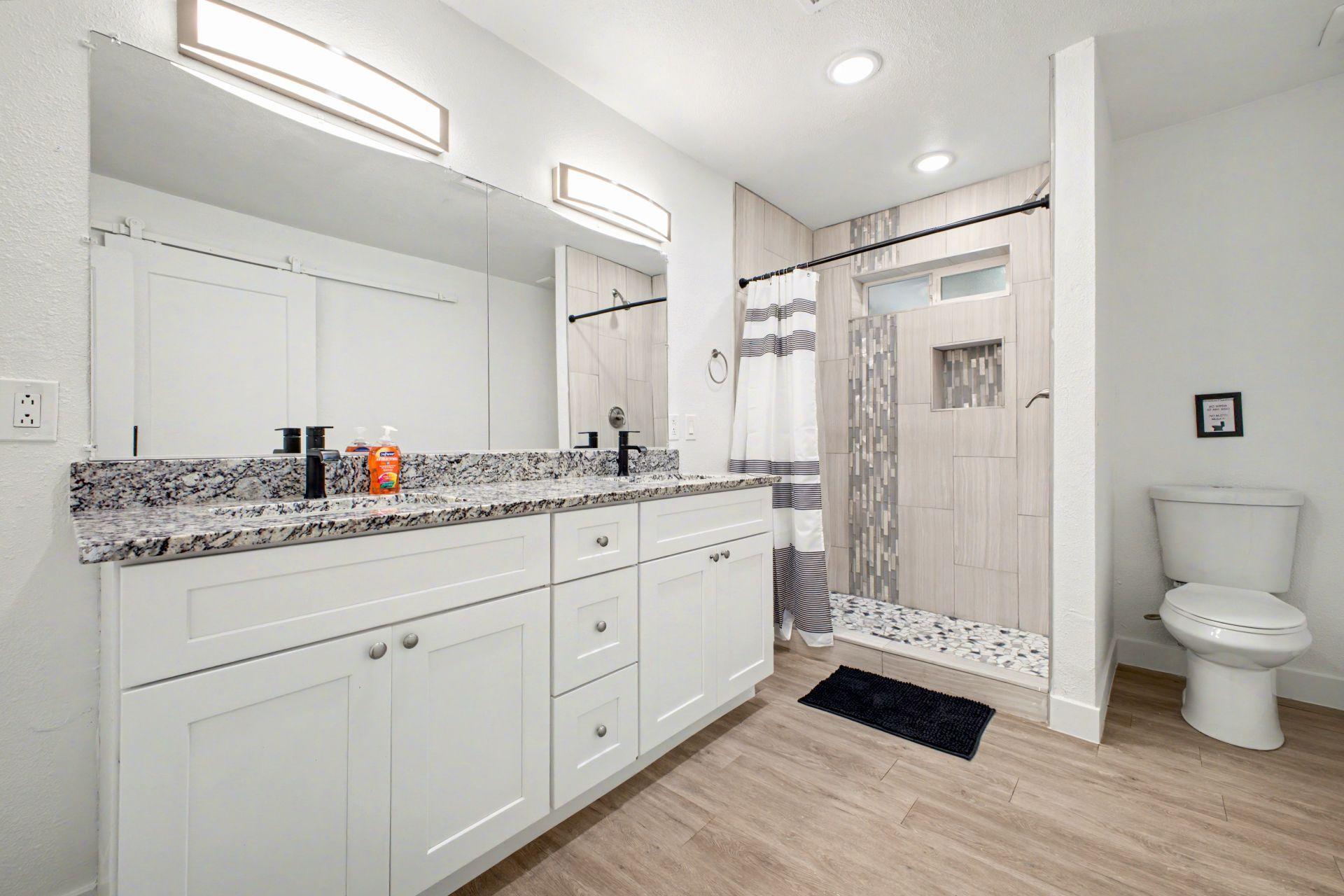 Double Sink Vanity and Large shower with lots of cabinet space!