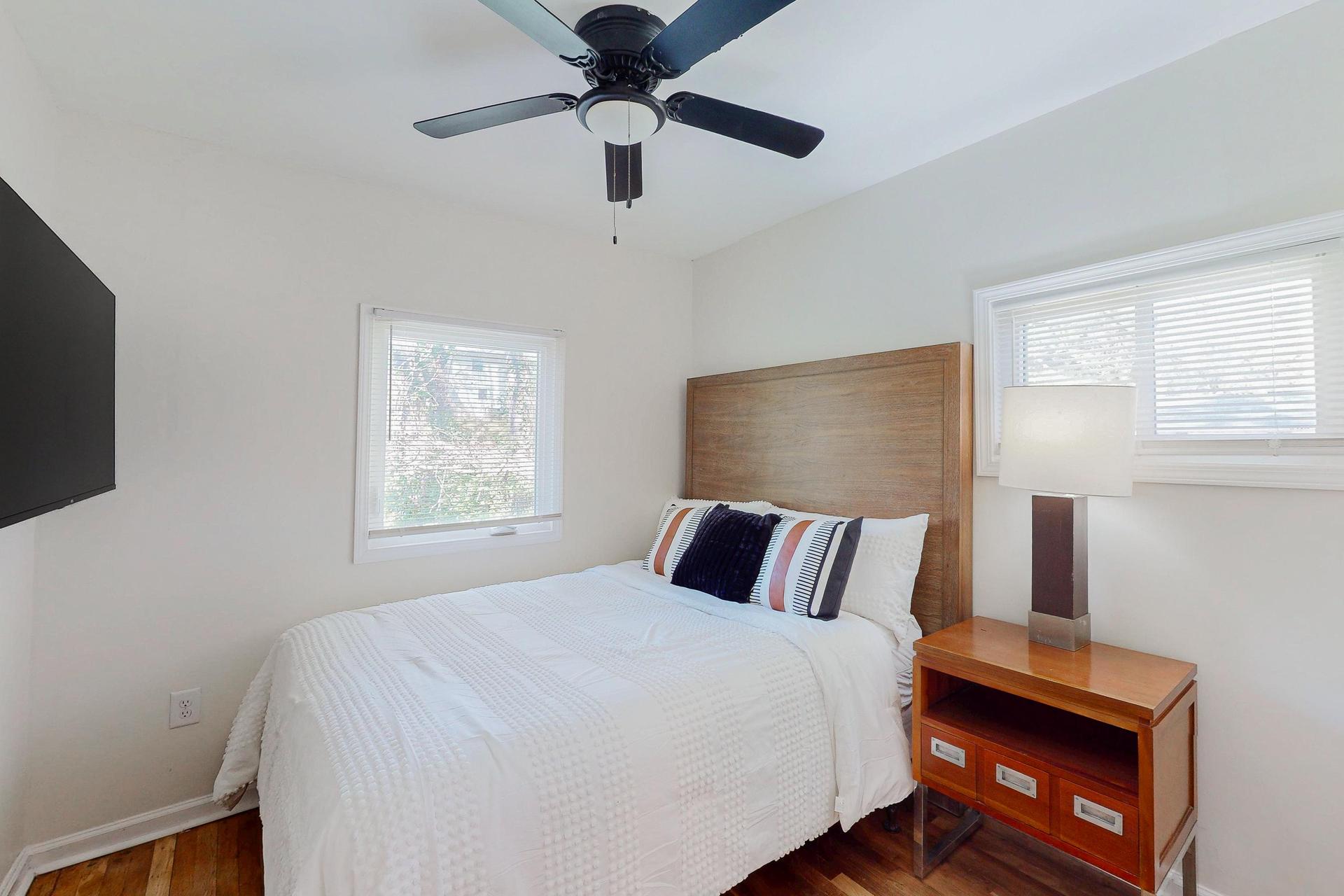 This cozy room (9 ft by 9.5 ft) is packed with amenities like a 50" TV and queen bed