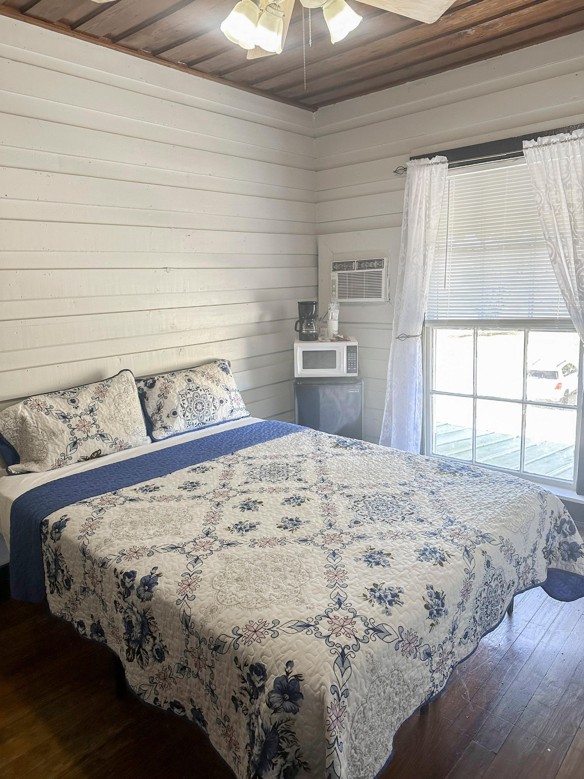 bedroom, detected:bed, window blind, ceiling fan