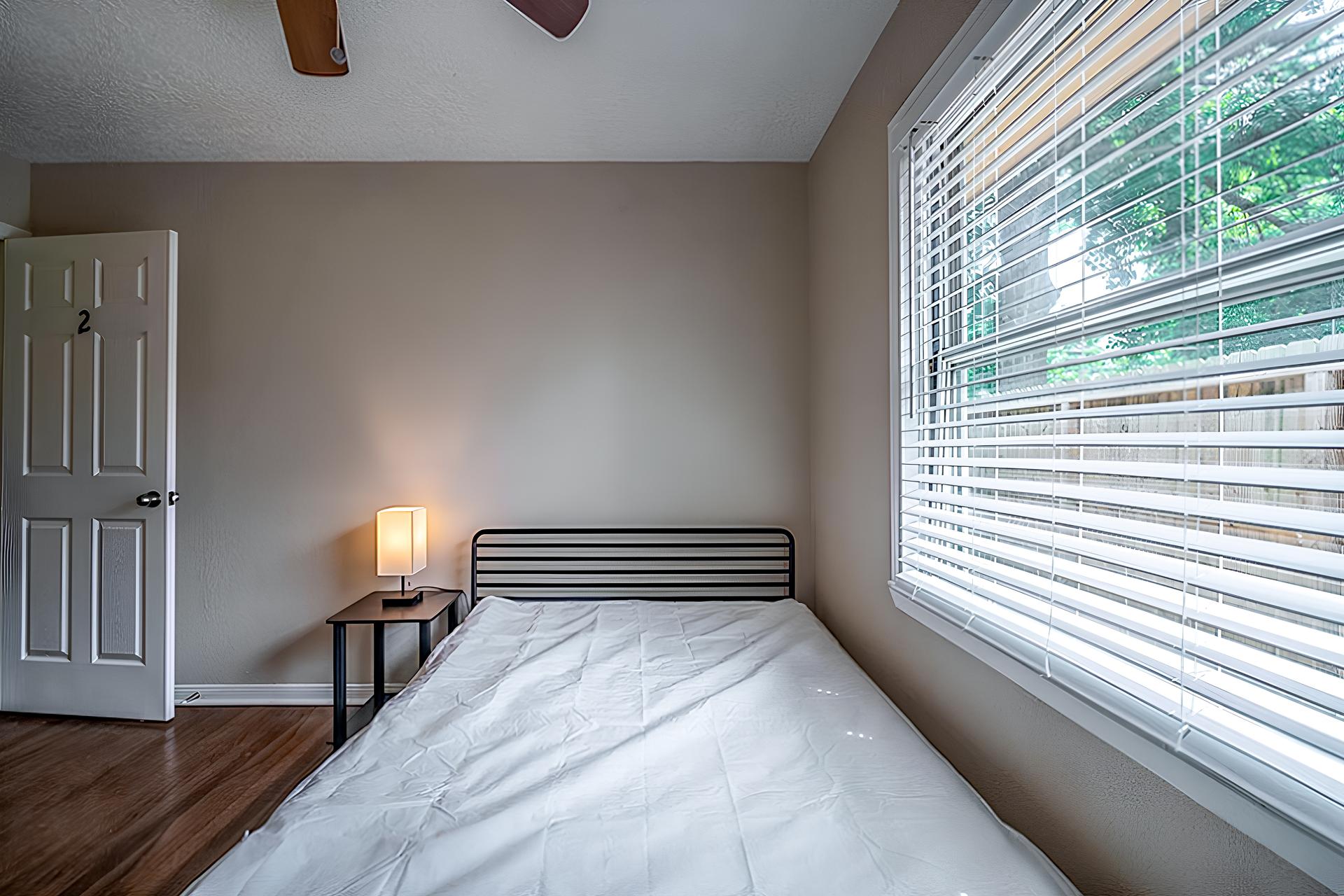 bedroom, detected: bed, window blind, ceiling fan