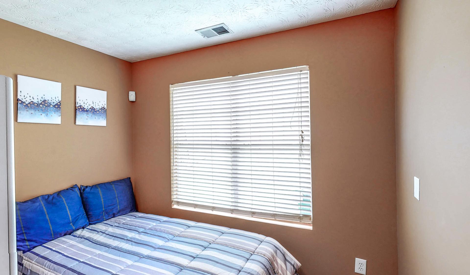 bedroom, detected: window blind, bed