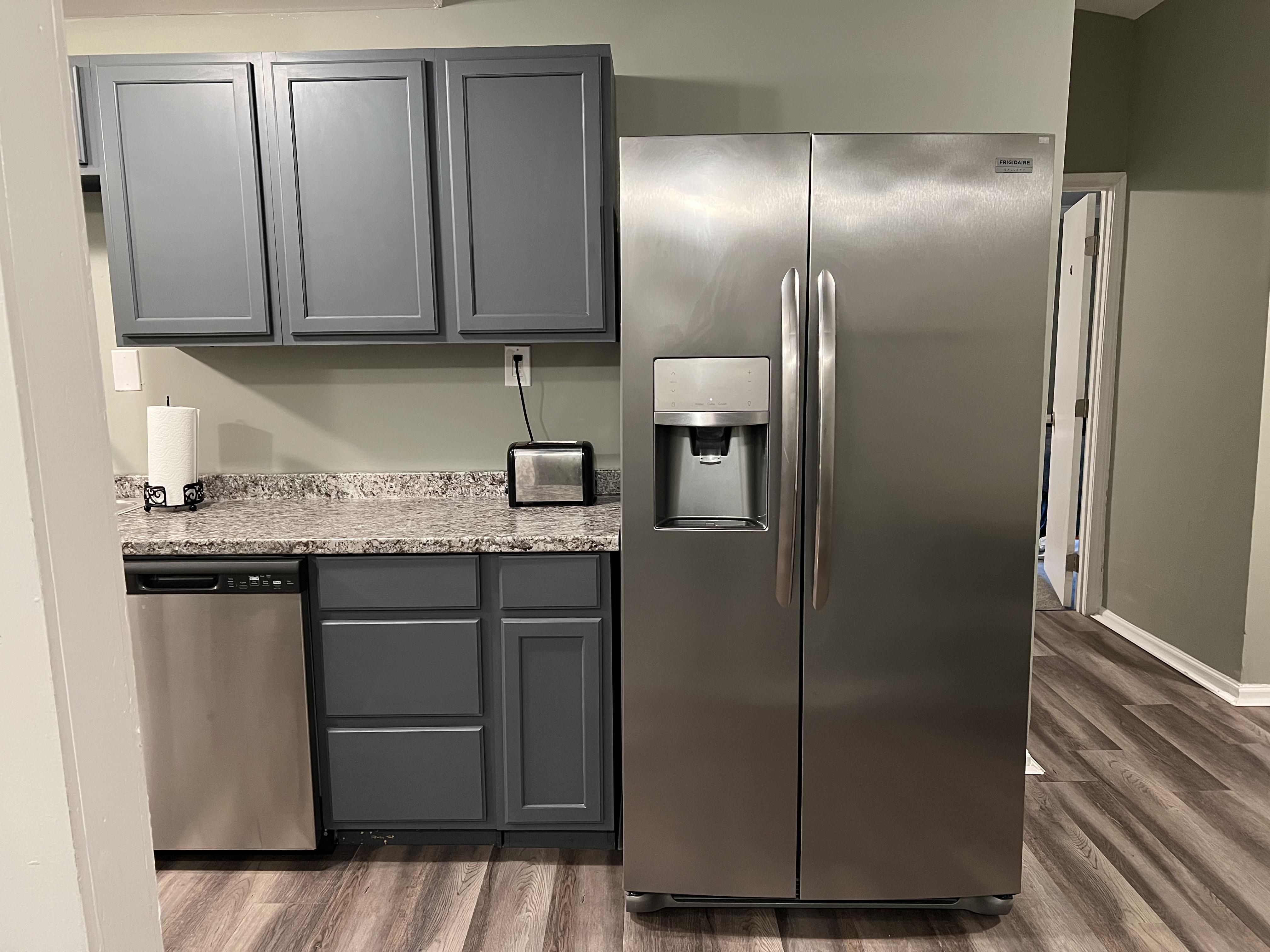 Kitchen - Frigidaire side-by-side digital unit with functional filtered water & ice-maker feature.