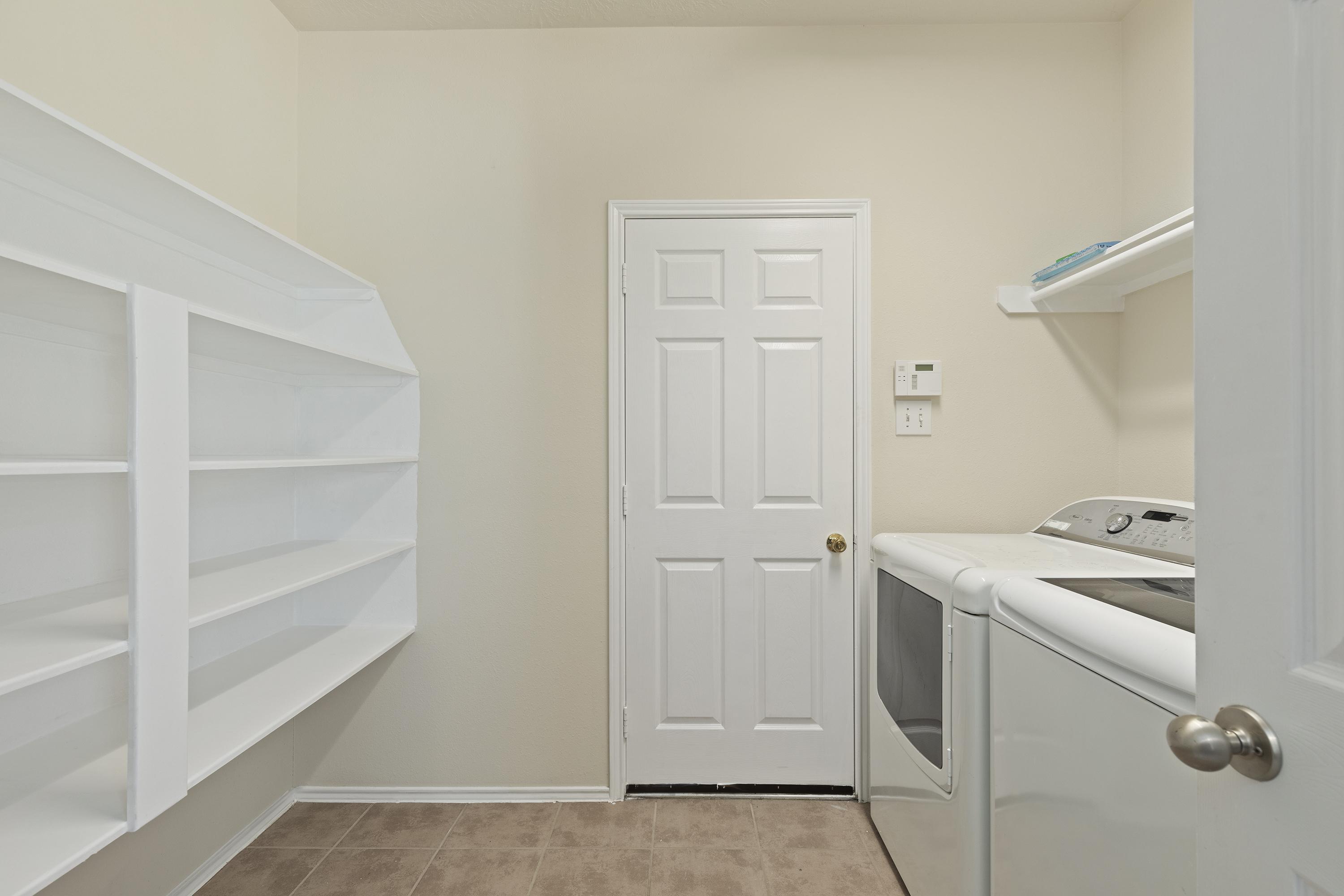 This pantry is a dream! Spacious for housing goodies and treats and includes luxury washer and dryer!