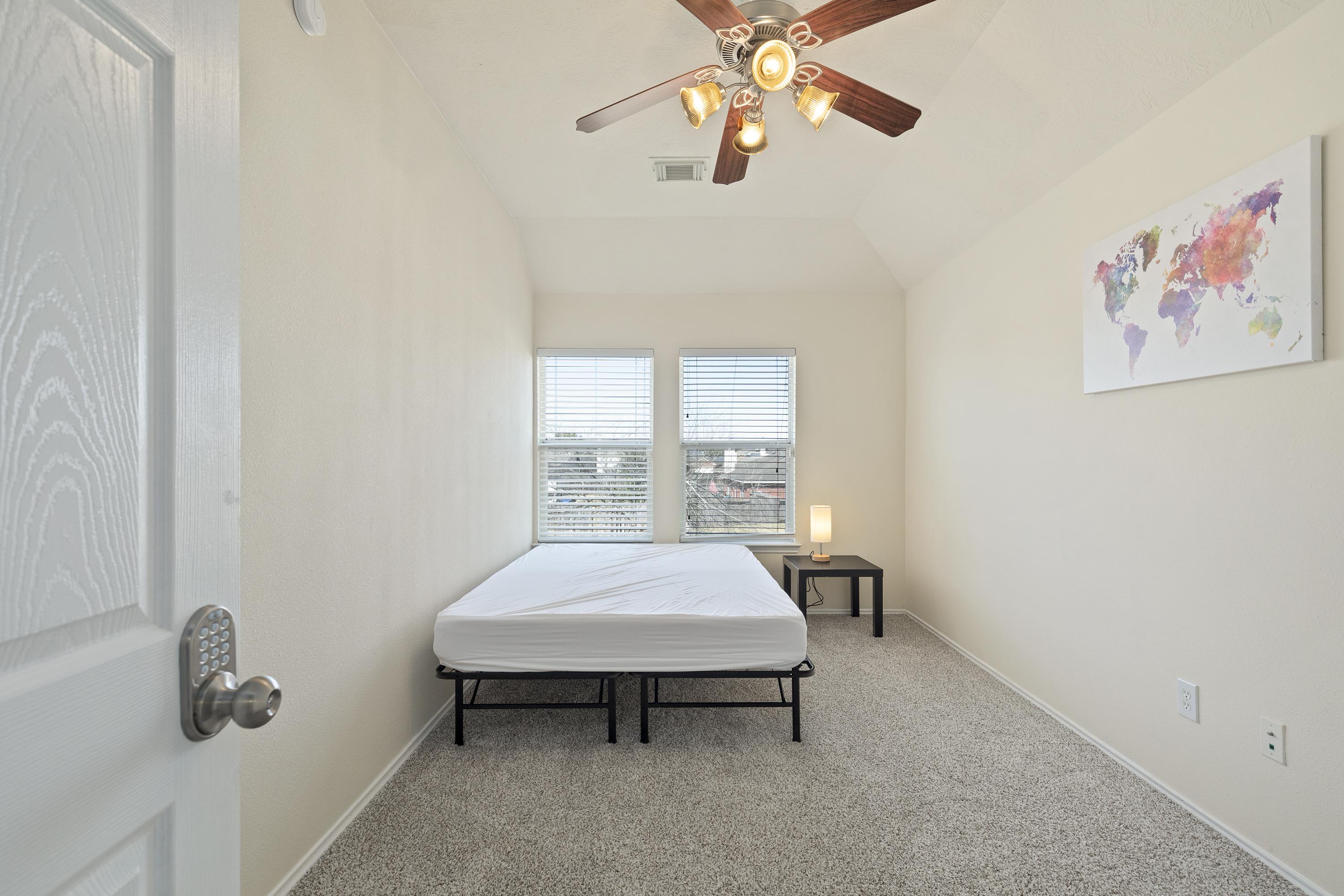 Beautiful room, Plush carpet w nightstand! Lamp is LED with charge port.  Includes Ceiling fan and shelving!