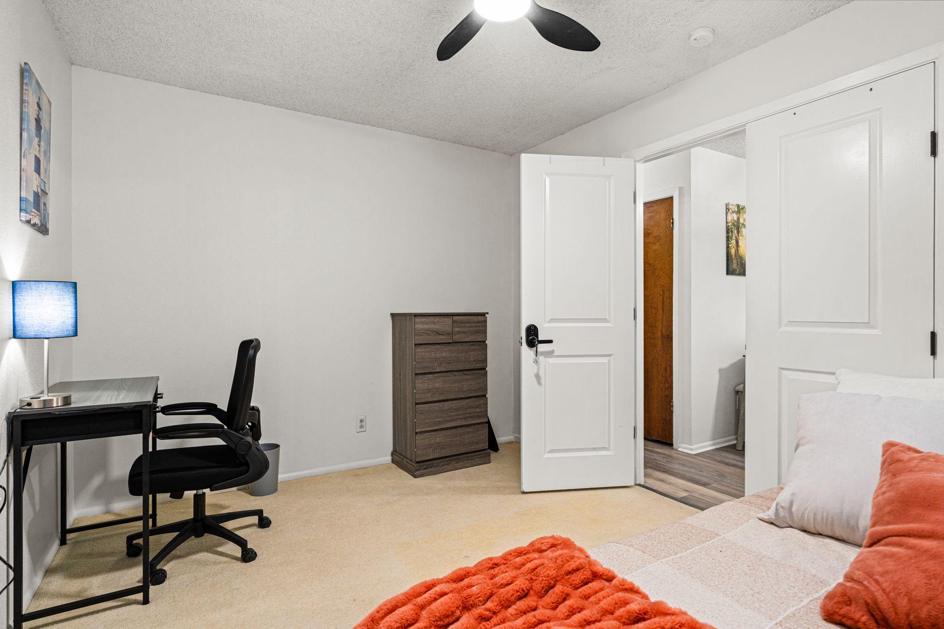 Nice size room, full bed, desk, dresser, TV and closet space. photo 2